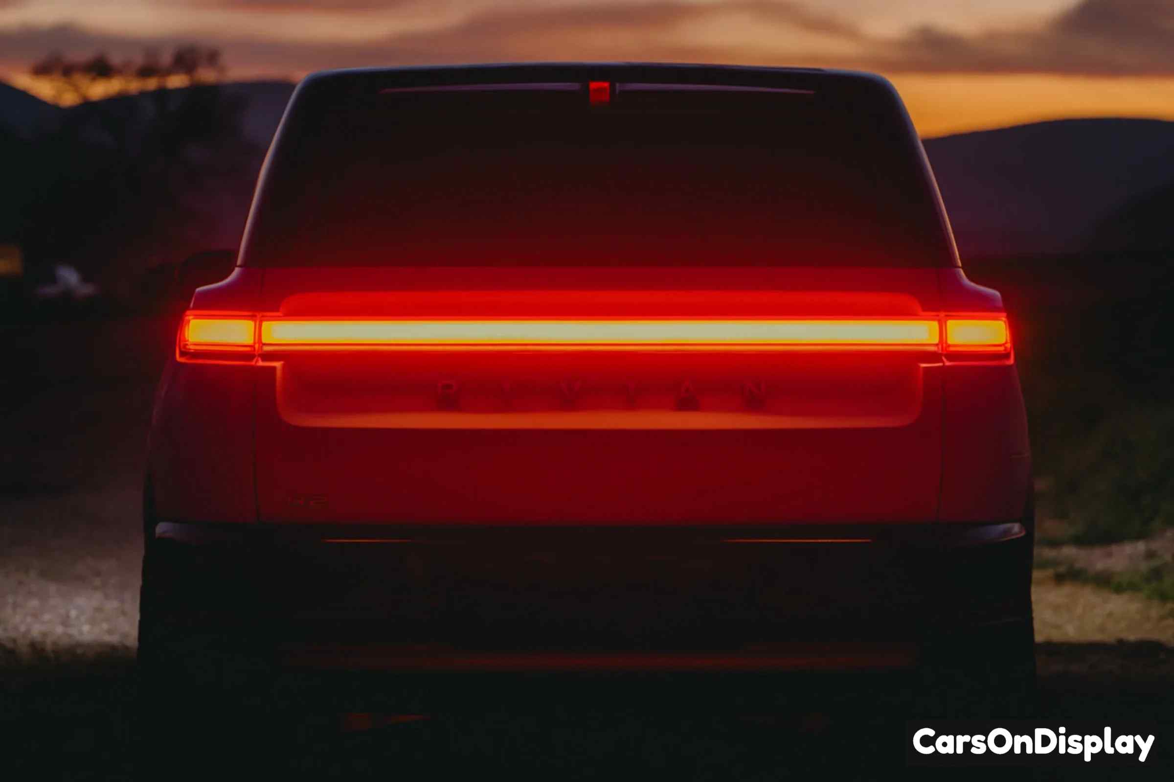 Rivian R2 LED rear lightbar - the spare tire mounts under the cargo floor, not on the tailgate